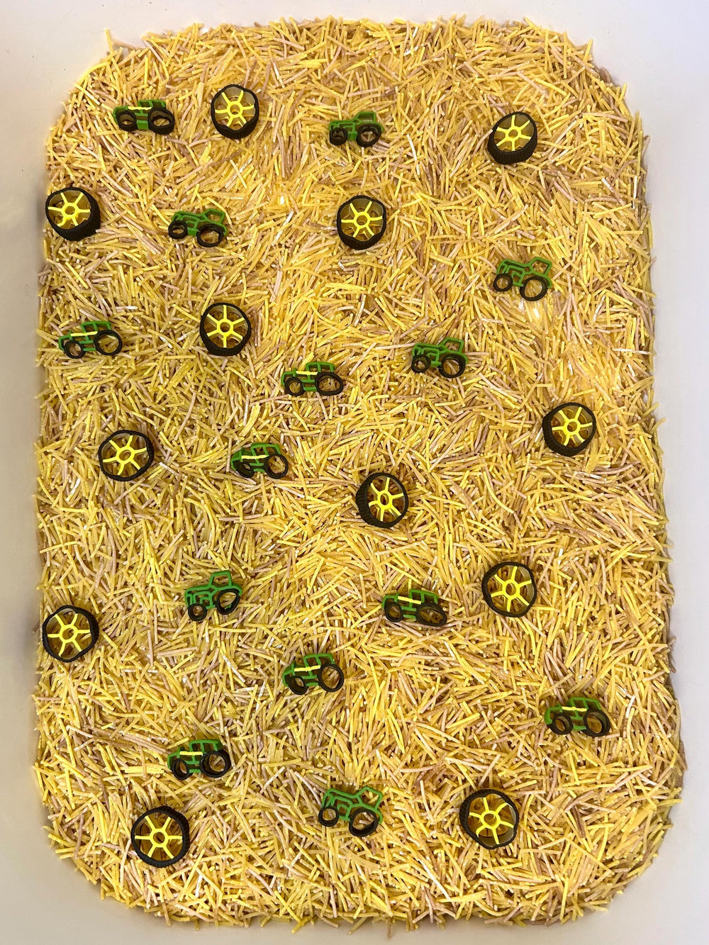 Farm Tractor Sensory Filler | Hay Pasta Sensory Bin Mix | Tractor Wheel Pasta | Montessori Farm Sensory Play | Playful Creations Co.